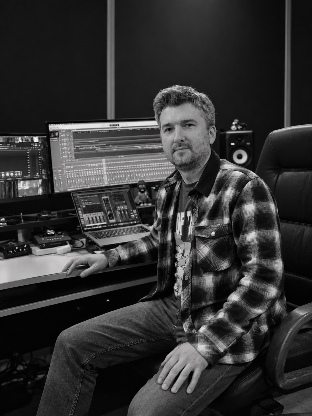 Black-and-white portrait of Kostya Leontovich in his recording studio